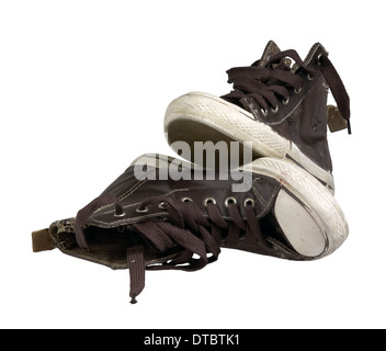 a pair of old brown sneakers in white back Stock Photo