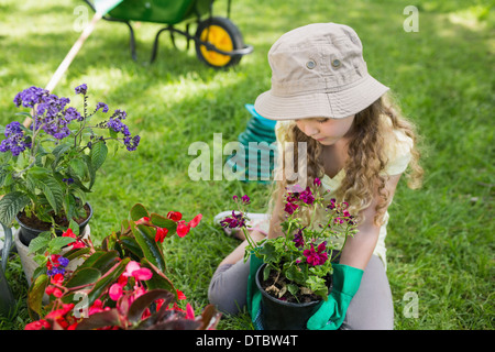 Little young girl engaged in gardening Stock Photo