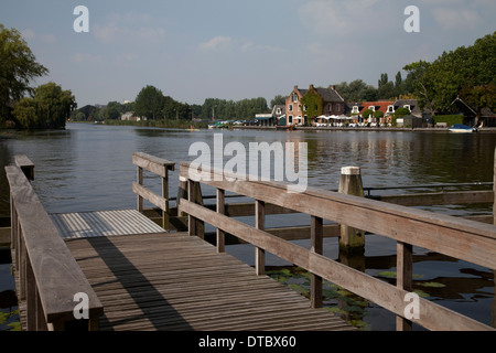 Wooden pier on river at Amstelhoek, The Netherlands Stock Photo