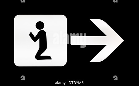 White illuminated sign with direction for prayer room on airport Stock Photo