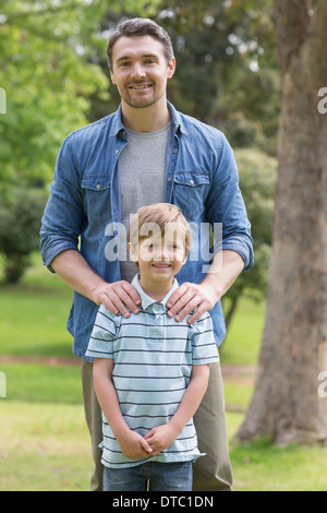 Portrait of a father and boy at park Stock Photo - Alamy