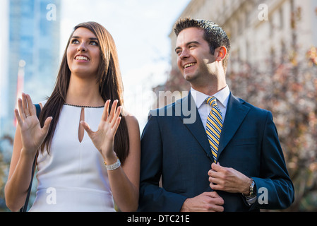 Smart young couple on city street, Toronto, Ontario, Canada Stock Photo
