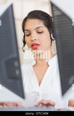 Customer service representative using computer Stock Photo
