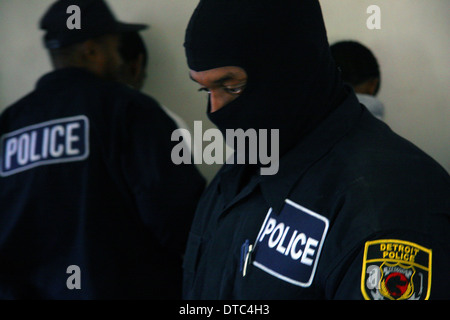 Detroit police department narcotics officers - narcs - raid a house for drugs. Stock Photo