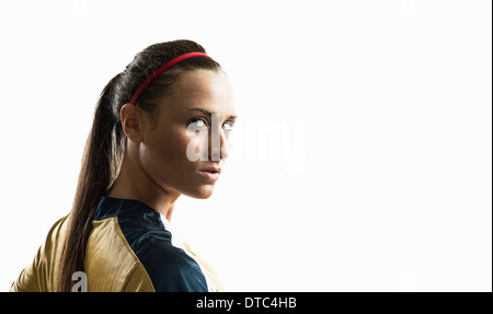 Studio portrait of young female soccer player Stock Photo