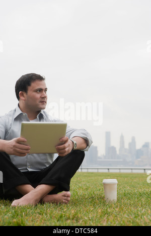 Businessman using laptop, Hoboken, New Jersey, USA Stock Photo