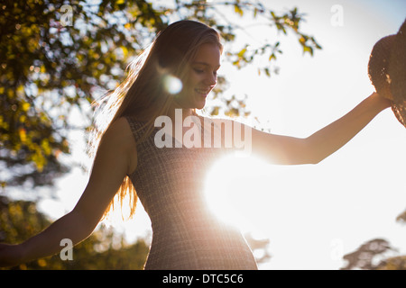 Teenage girl dancing in park Stock Photo