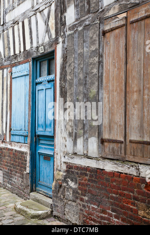 Painted shutters and door of a 16th century half-timbered building in Honfleur, Normandy, France Stock Photo