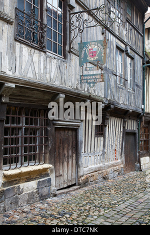 Honfleur, Normandy, France. Lane of 16th century half-timbered buildings beside the old harbour. Stock Photo