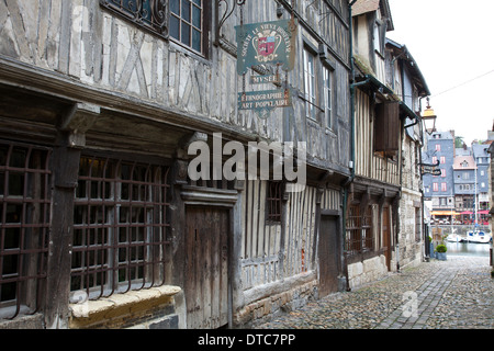 Honfleur, Normandy, France. Lane of 16th century half-timbered buildings beside the old harbour. Stock Photo