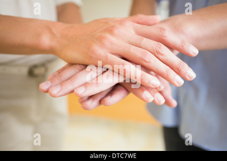 Business people stacking hands Stock Photo