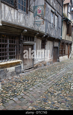 Honfleur, Normandy, France. Lane of 16th century half-timbered buildings beside the old harbour. Stock Photo