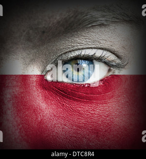 Human face painted with flag of Poland Stock Photo