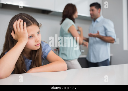Closeup of a sad girl while parents quarreling Stock Photo