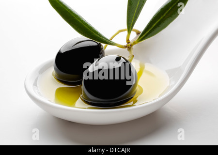 Black olives olive oil aceituna negra en aceite de oliva virgen extra Stock Photo