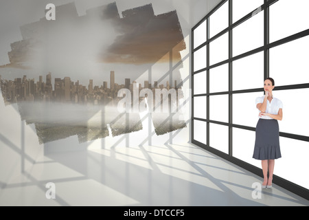 Composite image of pensive elegant businesswoman posing Stock Photo