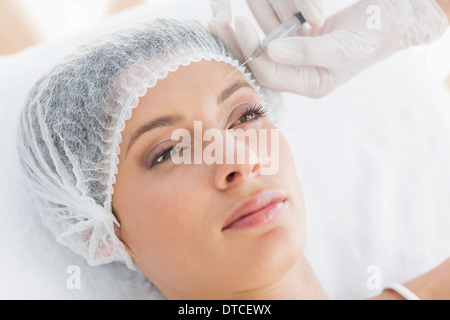 Beautiful woman receiving botox injection Stock Photo