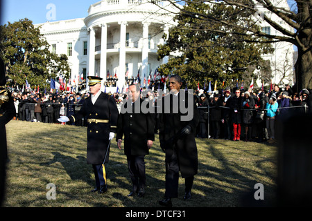 US President Barack Obama escorts French President Francois Hollande during the State Arrival ceremony on the South Lawn of the White House February 11, 2014 in Washington, D.C. Stock Photo