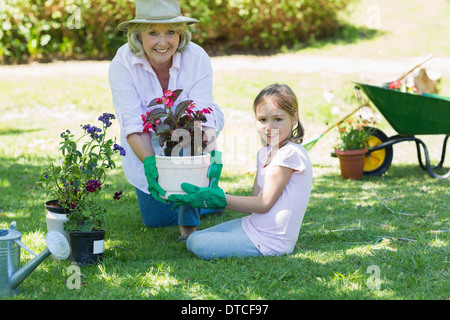 Grandmother and granddaughter engaged in gardening Stock Photo