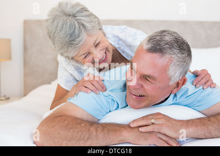 Senior couple lying in bed Stock Photo