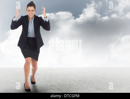 Composite image of angry businesswoman gesturing Stock Photo