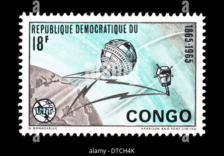 Postage stamp from the Congo Democratic Republic depicting satellites orbiting the Earth. Stock Photo