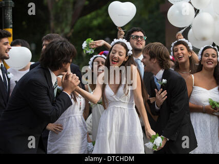 Buenos Aires, Argentina. 14th Feb, 2014. Members of the Caliope choir in wedding dresses and suits sing love songs to pedestrians on the Valentine's Day in Buenos Aires, Argentina, Feb. 14, 2014. Credit:  Martin Zabala/Xinhua/Alamy Live News Stock Photo