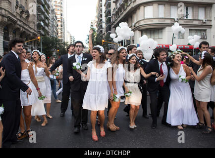 Buenos Aires, Argentina. 14th Feb, 2014. Members of the Caliope choir in wedding dresses and suits sing love songs to pedestrians on the Valentine's Day in Buenos Aires, Argentina, Feb. 14, 2014. Credit:  Martin Zabala/Xinhua/Alamy Live News Stock Photo