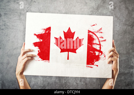 Man holding The National Flag of Canada Stock Photo - Alamy