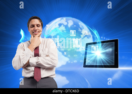 Composite image of thoughtful businessman with hand on chin Stock Photo