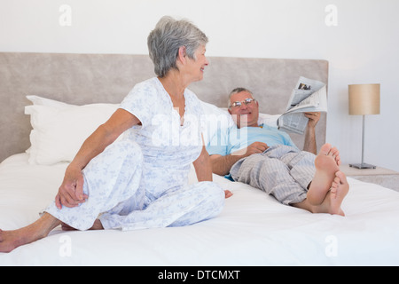 Senior couple relaxing in bed Stock Photo