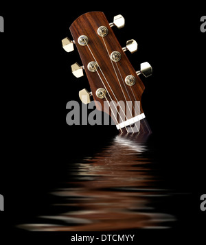 headstock of a acoustic guitar on reflective water surface in black back Stock Photo