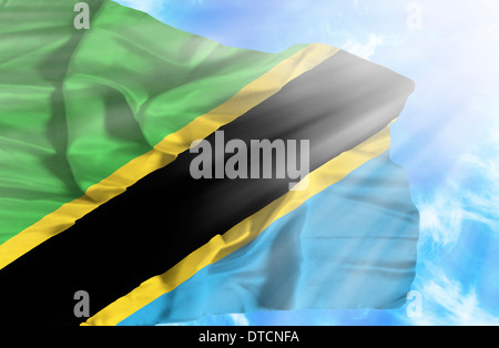 Tanzania waving flag against blue sky with sunrays Stock Photo