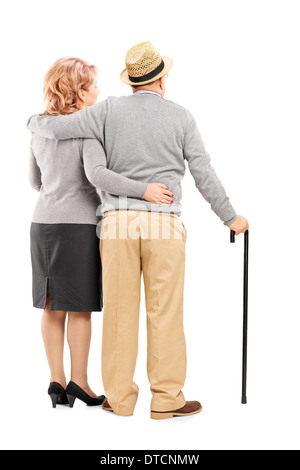 Studio shot of a happy senior couple hugging Stock Photo