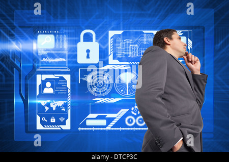 Composite image of thoughtful businessman with hand on chin Stock Photo
