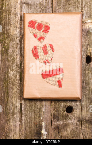 Wooden background with a hammered heart Stock Photo