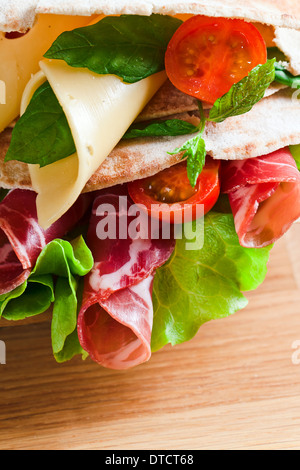 oriental bread with smoked meat and greens. Stock Photo