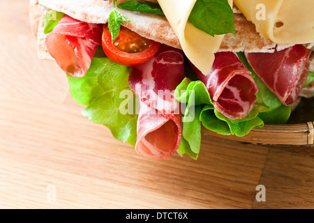 oriental bread with smoked meat and greens. Stock Photo