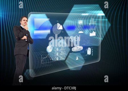 Composite image of thinking businessman touching chin Stock Photo