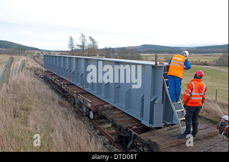 Steel supports from a dismantled bridge at Ravenscraig ready to cross the gap over the River Dulnain Strathspey. SCO 9309. Stock Photo