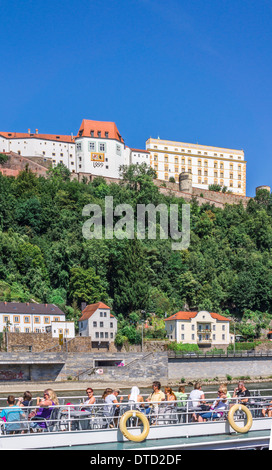 tourists on a excursion boat on the river danube in the background veste oberhaus  fortress, passau, bavaria, germany Stock Photo