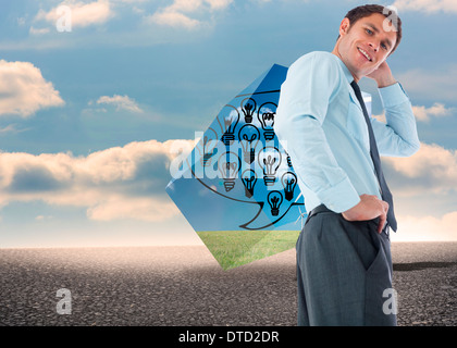 Composite image of thinking businessman with hand on head Stock Photo