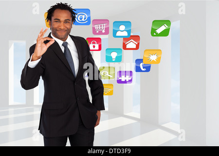 Composite image of businessman showing okay sign Stock Photo