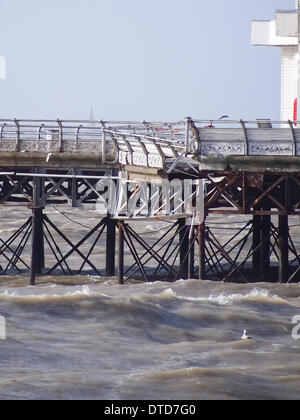 Portsmouth, Hampshire, England 15th February 2014.  South Parade Pier has been damaged by strong winds and large waves, leaving pieces of the Georgian structure hanging from the side of the pier. The pier has been closed to the public for over a year due to structural safety issues Credit:  simon evans/Alamy Live News Stock Photo