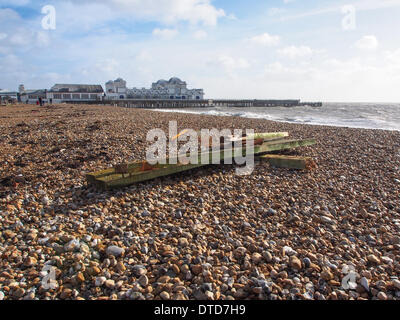 Portsmouth, Hampshire, England 15th february 2014. South Parade pier stands damaged in the solent due to high winds and large waves. pieces of the Georgian structure lie along Southsea beach. The pier has been closed to the public due to structural safety issues for over a year Credit:  simon evans/Alamy Live News Stock Photo