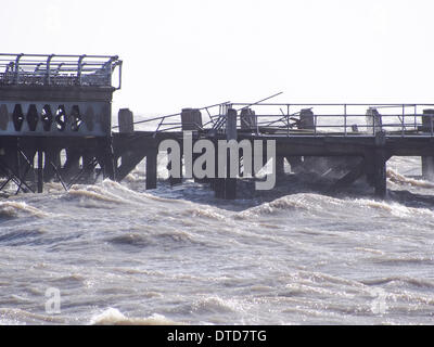 Portsmouth, Hampshire, England 15th february 2014. South Parade pier stands damaged in the solent due to high winds and large waves. pieces of the Georgian structure lie along Southsea beach. The pier has been closed to the public due to structural safety issues for over a year Credit:  simon evans/Alamy Live News Stock Photo