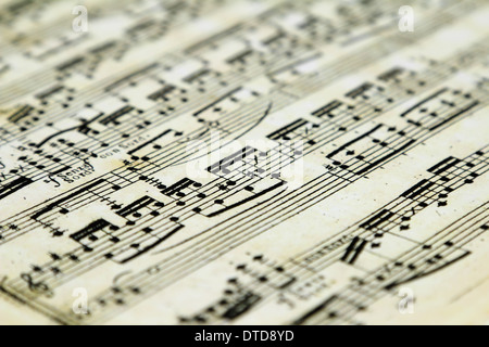 Old sheet music with notes close-up. Selective focus. Stock Photo