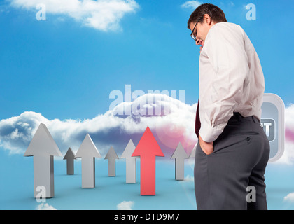 Composite image of thinking businessman touching his glasses Stock Photo
