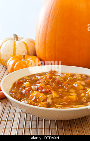 Fall time stew of pumpkin, tomatoes, beans and other vegetables Stock Photo