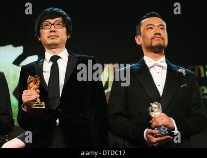 Berlin, Berlinale International Film Festival in Berlin. 15th Feb, 2014. Director Diao Yinan (L) of 'Black Coal, Thin Ice' , winner of the Golden Bear for the Best Film, and Liao Fan, winner of the Silver Bear for Best Actor for 'Black Coal, Thin Ice', pose for photos during the awards ceremony at the 64th Berlinale International Film Festival in Berlin, Feb. 15, 2014. Credit:  Zhang Fan/Xinhua/Alamy Live News